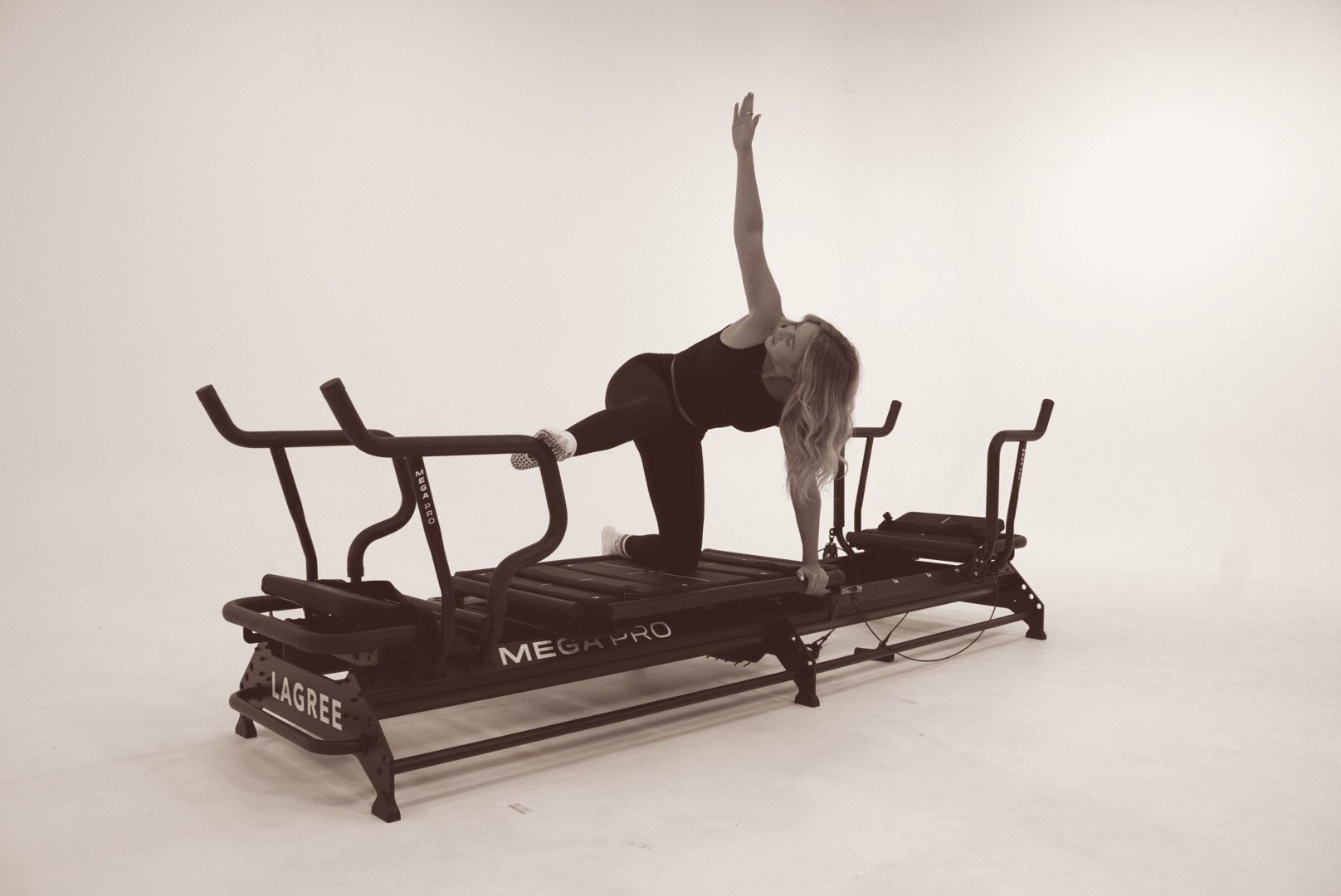Krista demonstrating an exercise on the Megaformer